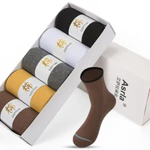 Close-up detail view of five pairs of assorted cotton socks presented in a gift box