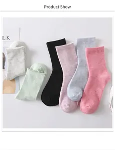 Detail view of colorful cotton crew socks in pink, blue, purple, black, green and grey