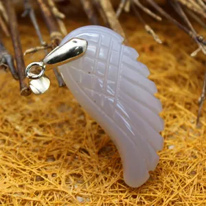 Elegant carved lavender stone wing pendant with silver bail charm