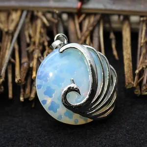 Elegant peacock pendant necklace featuring an opalite stone and a silver metallic frame