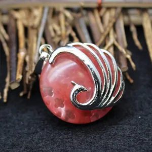 Exaggerated peacock pendant necklace with red aventurine gemstone and silver metal wrap