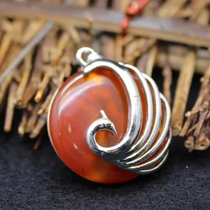 Stunning silver peacock pendant with a polished red aventurine gemstone for elegant women.