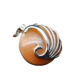 Artistic peacock necklace pendant featuring round red aventurine stone on white background