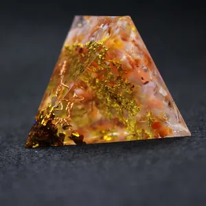 Handmade resin Orgonite pyramid with crystal chips and gold foil tree of life