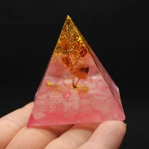 Handmade resin pyramid ornament featuring pink crystal stones and wire tree of life