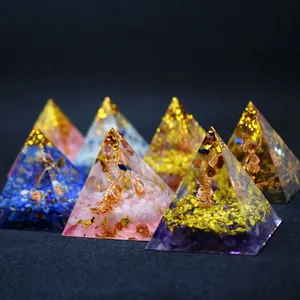 Assorted handmade Orgonite energy pyramids with natural crystal and copper tree of life