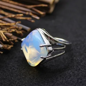 Minimalist silver ring featuring a large, exquisite rhombus-shaped opal stone.