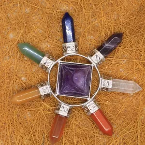 Natural stone chakra crystal pyramid ornament with seven faceted hexagonal points.