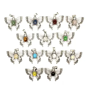 Macro view of thirteen butterfly pendants featuring assorted colorful natural stones