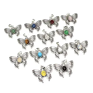 Set of diverse butterfly-shaped natural stone pendants in antique silver finish for necklaces