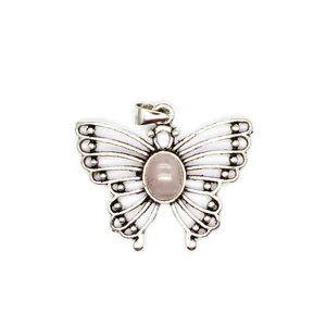 Close-up of silver butterfly pendant with oval pink quartz stone