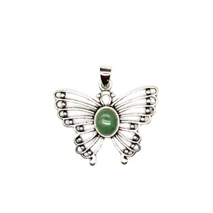 Detailed view of a silver butterfly pendant with an oval green malachite gemstone inlay