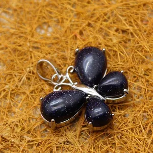 Elegant blue sandstone butterfly pendant with sparkling stars effect in silver setting