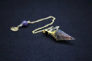 Elegant Baroque style crystal pendulum featuring a copper coil inside a clear cone