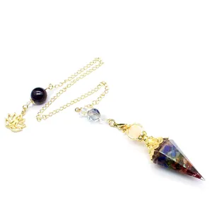 Detailed close-up of a Baroque style tourmaline crystal hexagonal pyramid pendulum
