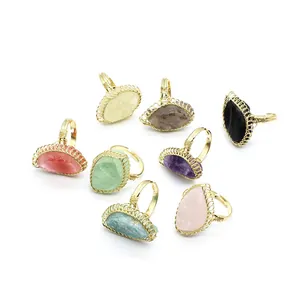 Collection of vintage wire-wrapped raw crystal rings in various colors and gemstones