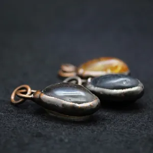 Handmade irregular natural stone pendant with vintage metal bezel detail
