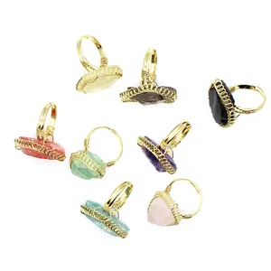 Assorted vintage wire-wrapped raw crystal rings in various natural stone colors