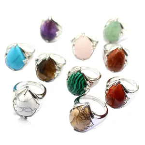 Adjustable teardrop gemstone rings in various colors with silver-tone prong setting
