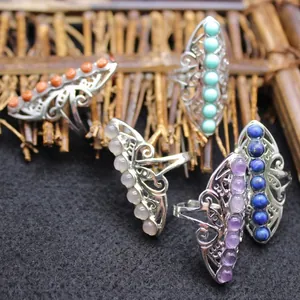 Set of vintage bohemian silver-tone adjustable rings featuring colorful crystal stones