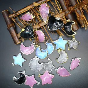 Detailed view of opalite and crystal pendants in star, moon, heart, and arrowhead shapes
