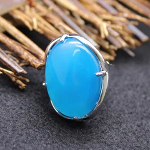 Adjustable fashion ring featuring a large oval blue agate stone in a silver setting