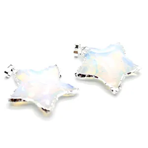 Detail shot of translucent star-shaped opal pendants with polished silver metallic edges