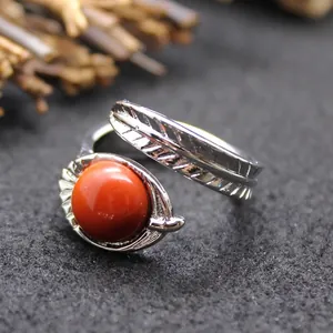 Vintage silver feather open ring with a vibrant orange red gemstone adjustable band