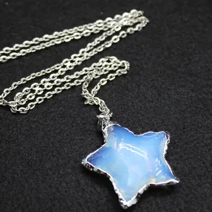 Minimalist star-shaped opal pendant necklace with silver chain on black background