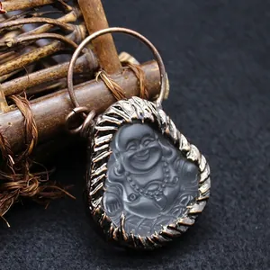 Colgante de Buda sonriente en obsidiana mate estilo étnico con marco de metal bronce.