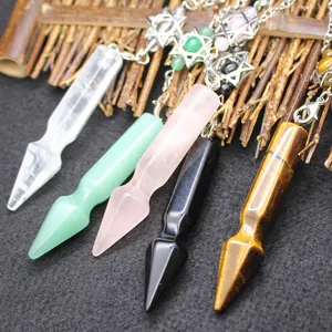 Set of natural crystal dowsing pendulums featuring hexagram charms and arrow points