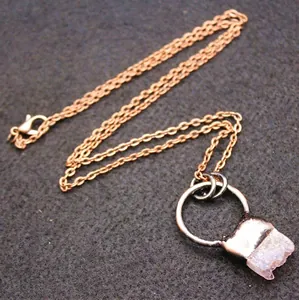 Minimalist purple amethyst raw stone pendant necklace with elegant copper-colored chain.