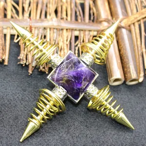 Amethyst crystal pyramid energy generator with golden four-way spring cross base