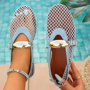 Detailed shot of light blue fishnet mesh sandals with metallic buckle and closed toe
