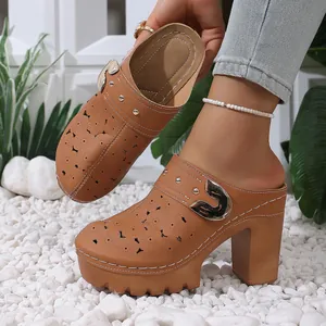 Elegant brown laser-cut chunky high heel platform clogs with golden buckle detail