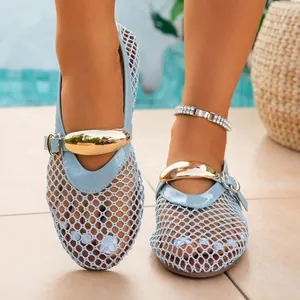 Close-up of light blue mesh hollow-out flat sandals with elegant gold buckle ornament.