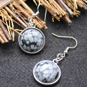 Elegant silver-plated hook earrings featuring round natural snowflake obsidian stones
