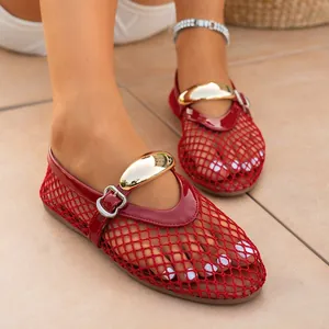 Close-up detail of red mesh hollow flat sandals featuring a stylish gold buckle closure