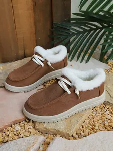Stylish brown fleece-lined snow boots with white fur trim and lace-up design for winter