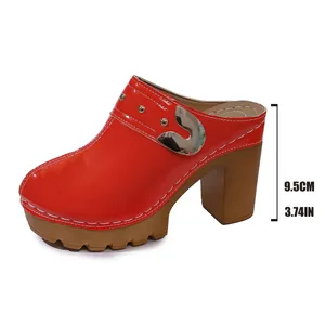 Side view of red patent leather platform mules with chunky high heel and rivet details