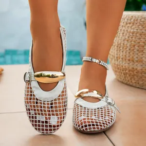 Detailed view of white mesh hollowed-out flat sandals featuring a stylish gold metal buckle