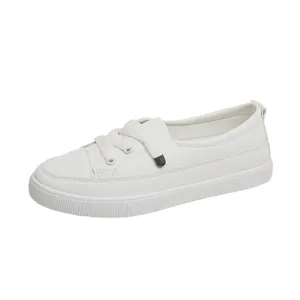 Side angle detailed view of minimalist white casual women's sneakers with lace-up design.