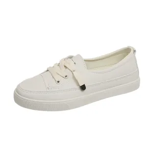 Detailed side view of a minimalist white women's casual plimsoll sneaker for travel