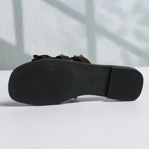 Bottom view of women's flat sandal showing sole texture and size 37 mark