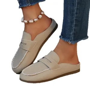 Casual women's beige suede flat mule loafers with round toe and stitching detail