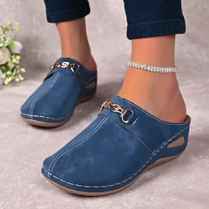 Stylish blue closed-toe wedge mules for women with golden chain and contrast stitching
