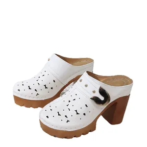 White fashion platform clogs with floral hollow out design and chunky high heels