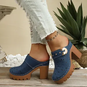 Elegant blue laser-cut block heel mules for women featuring a sturdy platform sole