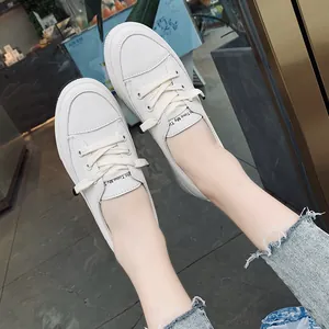 Detailed top-down view of white platform sneakers with Time My Time text