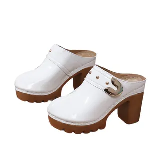 White patent leather chunky heel platform clogs with gold rivet details for women